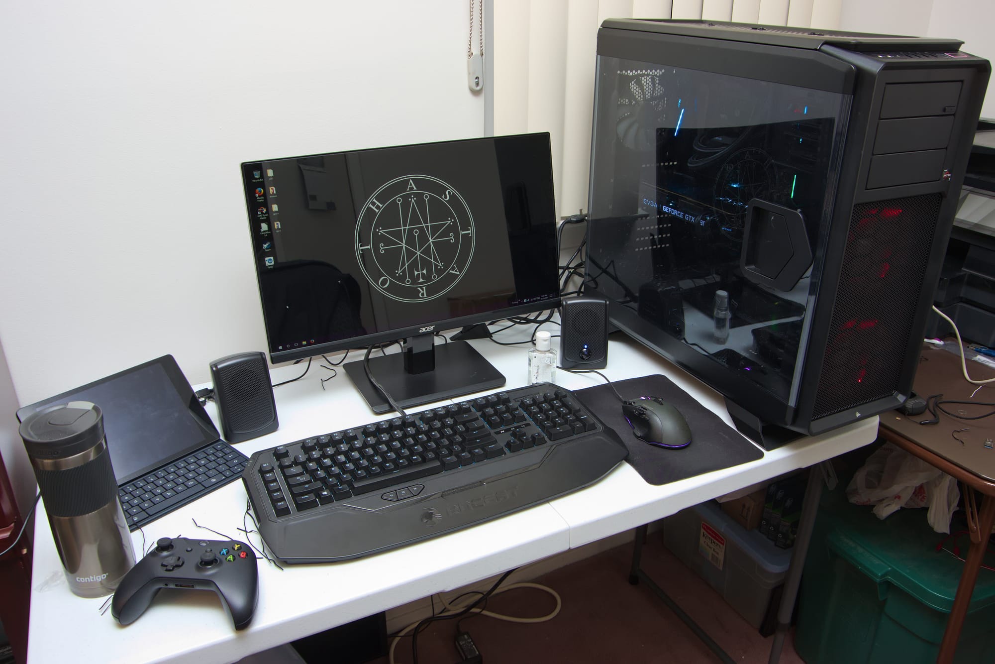 High-end gaming PC setup with monitor, keyboard, and RGB lighting
