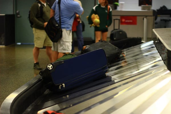 Suitcases on an airport baggage claim carousel